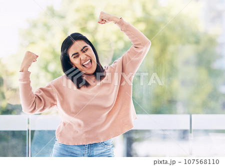 Yes, winner and Indian woman with winning, success and bonus arms or fist pump for excited news. Celebration, freedom and dance of a happy young person dancing for opportunity, achievement or results Yes, winner and Indian woman with winning, success and bonus arms or fist pump for excited news. Celebration, freedom and dance of a happy young person dancing for opportunity, achievement or results 107568110