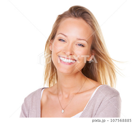 Happy, smile and portrait of a woman model in a studio with a positive, confident and optimistic mindset. Happiness, excited and face of a female from Canada posing while isolated by white background 107568885