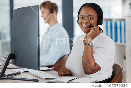 Sales, support and customer service call center consultant smiling while consulting with online clients in office. Contact us with happy agent enjoying job in telesales, excited about good service Sales, support and customer service call center consultant smiling while consulting with online clients in office. Contact us with happy agent enjoying job in telesales, excited about good service 107570326