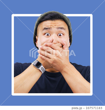 Portrait, man and hands over mouth for wow, shocked and news in studio for advertising on blue background. Omg, face or emoji by asian guy shock for secret, drama or secret on mockup space isolated 107571183