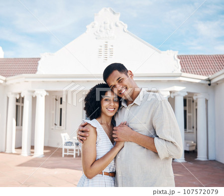 New home, happy and portrait of couple hug for house, property and real estate investment. Homeowner, marriage and man and woman embrace for care, trust and excited for purchase, buying and mortgage New home, happy and portrait of couple hug for house, property and real estate investment. Homeowner, marriage and man and woman embrace for care, trust and excited for purchase, buying and mortgage 107572079