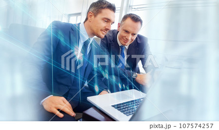 Overlay, business people and manager with employee, laptop and accountant with financial planning, internet or hologram. Staff, investor or men with trading, pc or stock market with feedback or email 107574257