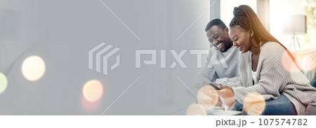 Bokeh, happy and young couple on sofa in the living room talking, bonding and laughing together. Love, smile and African man and woman in conversation sitting in the lounge of modern home with mockup 107574782