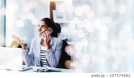 Bokeh, phone call and black woman in business office, communication and mobile conversation. Smartphone, chat and happy consultant listening to discussion, news and negotiation at table in company 107574882