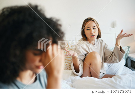 Women, lgbt couple and arguing in bed, home and talking with frustration, stress and headache. Communication, choice and sad for relationship, problems and fight for love, conversation and conflict Women, lgbt couple and arguing in bed, home and talking with frustration, stress and headache. Communication, choice and sad for relationship, problems and fight for love, conversation and conflict 107575073