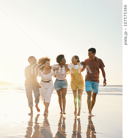 Summer, space and travel with friends at beach for freedom, support and sunset. Wellness, energy and happy with group of people walking by the sea for peace, adventure and Hawaii vacation mockup 107575360