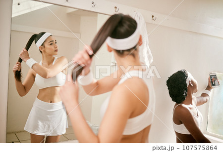 Tennis, selfie and women in change room of sports club with picture for social media wellness and fitness post. Mirror, training and influencer friends live streaming online together at exercise Tennis, selfie and women in change room of sports club with picture for social media wellness and fitness post. Mirror, training and influencer friends live streaming online together at exercise 107575864