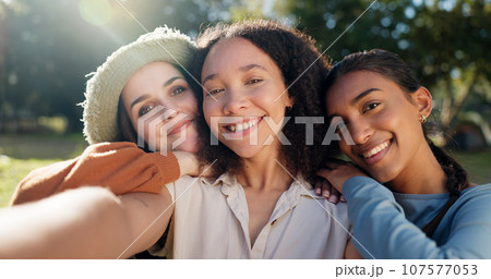 Selfie of group of women, camping and nature for summer vacation with smile, trees and sunshine. Relax, portrait of happy friends in forest on camp holiday with friendship, diversity and outdoor time 107577053