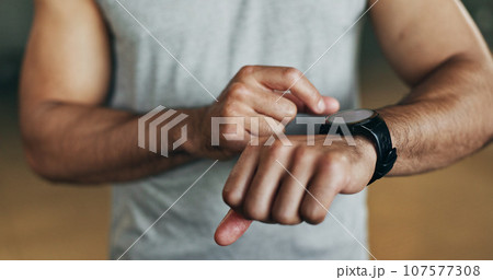 Smart watch, hands and man in gym for fitness, exercise results and workout performance. Stopwatch, closeup and check information, timer and tracking healthy training progress, clock and sports gear Smart watch, hands and man in gym for fitness, exercise results and workout performance. Stopwatch, closeup and check information, timer and tracking healthy training progress, clock and sports gear 107577308
