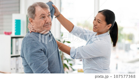 Old man, patient and physiotherapy of arm, medical rehabilitation or consulting doctor. Woman, physiotherapist and stretching for assessment of shoulder pain, arthritis or healthcare advice in clinic Old man, patient and physiotherapy of arm, medical rehabilitation or consulting doctor. Woman, physiotherapist and stretching for assessment of shoulder pain, arthritis or healthcare advice in clinic 107577368