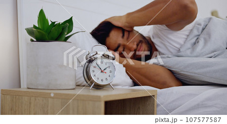 Stress, insomnia and man in bedroom, anxiety and depression with mental health problems. Male, guy and sleepless in bed, tired and overthinking with fatigue, alarm clock and frustrated with issues Stress, insomnia and man in bedroom, anxiety and depression with mental health problems. Male, guy and sleepless in bed, tired and overthinking with fatigue, alarm clock and frustrated with issues 107577587
