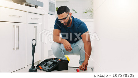 Plumber man, tools and box on floor maintenance with packing, focus and pipe repair service in house. Entrepreneur handyman, plumbing expert and small business owner with toolbox in home kitchen 107578508