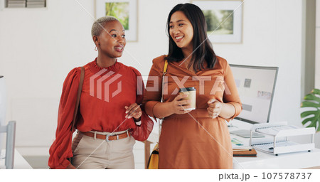 Business people, walking and happy conversation in an office with coffee, smile or friendly chat. Work, friends and women with diversity, discussion or gossip, news or project, idea or communication Business people, walking and happy conversation in an office with coffee, smile or friendly chat. Work, friends and women with diversity, discussion or gossip, news or project, idea or communication 107578737