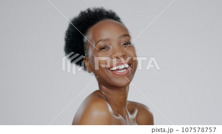 Face, skincare and beauty of funny black woman in studio isolated on a gray background mockup space. Portrait, natural cosmetics and African model laugh in spa facial treatment, wellness and health Face, skincare and beauty of funny black woman in studio isolated on a gray background mockup space. Portrait, natural cosmetics and African model laugh in spa facial treatment, wellness and health 107578757