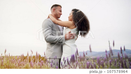 Wedding, dance and couple in garden with love, celebration and excited for future together. Field, happy man and woman at boho marriage reception with flowers, music and commitment at party in nature 107578964