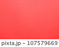 赤い色画用紙を撮影した質感のあるテクスチャー素材　背景 107579669