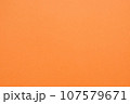 オレンジの色画用紙を撮影した質感のあるテクスチャー素材　背景 107579671