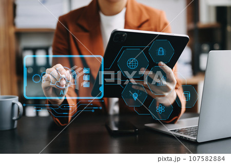 Woman using chatbot in computer and tablet  smart intelligence Ai.Chat with AI Artificial Intelligence, developed by OpenAI generate. Futuristic technology, robot in online system.. 107582884