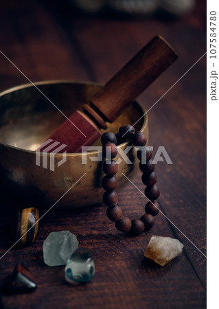 tibetan bowl with rosary beads tibetan bowl with rosary beads 107584780