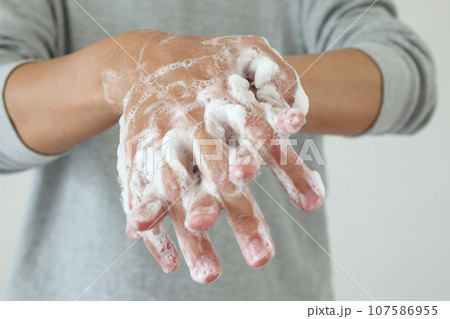 Man wash hands with soap for COVID-19 corona virus prevention concept Man wash hands with soap for COVID-19 corona virus prevention concept 107586955