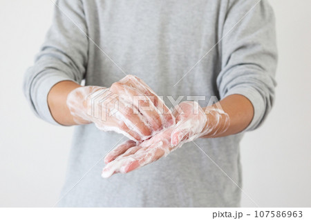 Man wash hands with soap for COVID-19 corona virus prevention concept Man wash hands with soap for COVID-19 corona virus prevention concept 107586963