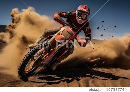 Motocross rider creates a huge cloud of dust and debris 107587744
