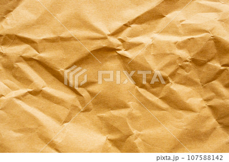 Brown crumpled paper recycled kraft sheet texture background 107588142