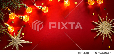red paper background with fir branches red paper background with fir branches 107588687