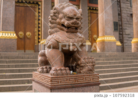 stone statue of a lion at the entrance to the Buddhist datsan Gunzechoinei stone statue of a lion at the entrance to the Buddhist datsan Gunzechoinei 107592318