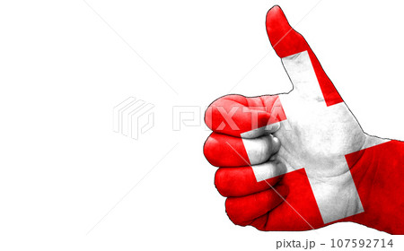 thumbs up in approval with the Swiss flag painted thumbs up in approval with the Swiss flag painted 107592714