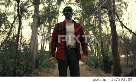 Assassin Mad Man With Bladed Weapon Find His Victim In The Forest 107593304
