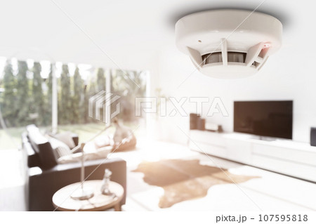 smoke detector fire alarm detector home safety device setup at home apartment room ceiling 107595818