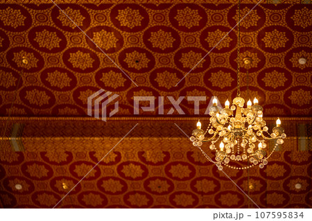 Thai temple ceiling interior Chandelier with hand drawing pattern most exquisite beauty meticulous craftsmanship stunningly beautiful. Thai temple ceiling interior Chandelier with hand drawing pattern most exquisite beauty meticulous craftsmanship stunningly beautiful. 107595834