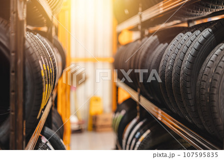 new car tire mix type on storage shelf at warehoue stock inventory in auto garage workshop for sale new car tire mix type on storage shelf at warehoue stock inventory in auto garage workshop for sale 107595835