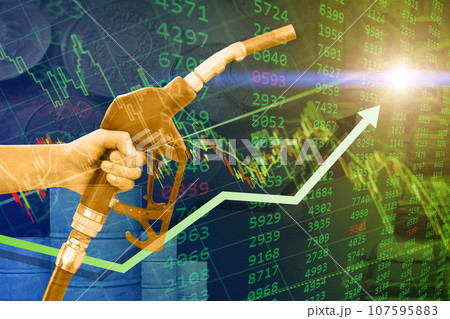 crude oil retail price increase rise high concept, green business stock chart overlay hand with fuel nozzle up arrow. crude oil retail price increase rise high concept, green business stock chart overlay hand with fuel nozzle up arrow. 107595883
