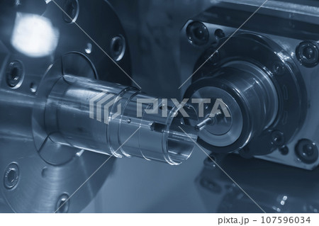 The multi-tasking CNC lathe machine cutting the metal cylindrical parts by milling spindle. The multi-tasking CNC lathe machine cutting the metal cylindrical parts by milling spindle. 107596034
