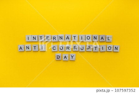 December 9, International Anti-Corruption Day, minimalistic banner with the inscription in wooden letters 107597352