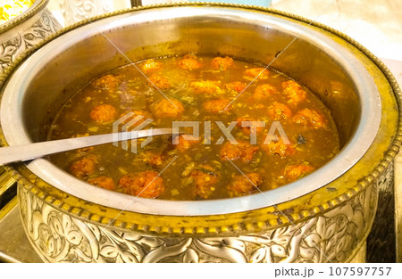 A picture of vegetable curry with selective focus 107597757