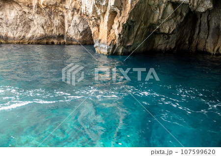 Malta, Wied iz Zurrieq, Blue Cave with turquoise waters 107599620