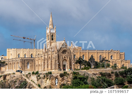 Malta, Gozo, view of Our Lady of Lourdes, Mgarr church on top of a hill Malta, Gozo, view of Our Lady of Lourdes, Mgarr church on top of a hill 107599657