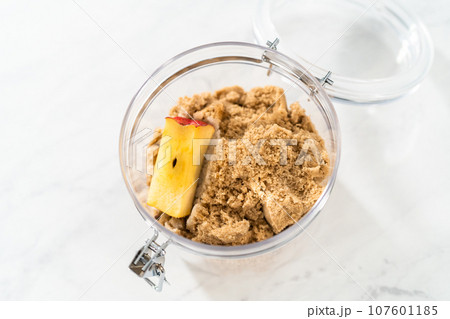 Making light brown sugar soft again with an apple core. Making light brown sugar soft again with an apple core. 107601185