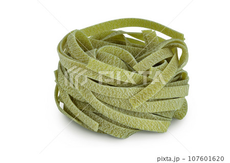 Raw tagliatelle green pasta with spinach isolated on white background 107601620