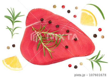 Fresh tuna fish fillet steak with rosemary, lemon and peppercorns isolated on white background with clipping path. Top view. Flat lay Fresh tuna fish fillet steak with rosemary, lemon and peppercorns isolated on white background with clipping path. Top view. Flat lay 107601678