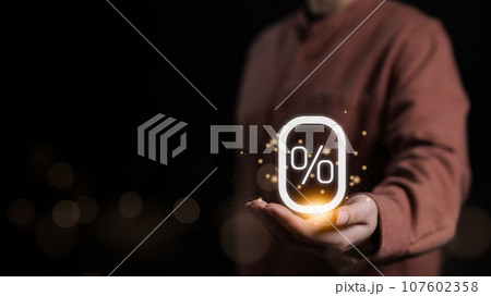Woman holding glowing zero percentage or 0 percent for special offer of shopping department store and shop discount. Installment rate plan, Interest rate, Promotion marketing, Sale campaign, Advert, Woman holding glowing zero percentage or 0 percent for special offer of shopping department store and shop discount. Installment rate plan, Interest rate, Promotion marketing, Sale campaign, Advert, 107602358