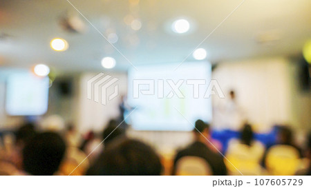 Blur background seminar business event in auditorium  hall convention audience presentation meeting at conference room present screen for entrepreneurs startup business. Blurred background copy space 107605729