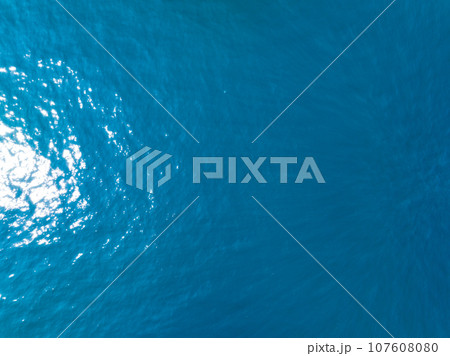 Sea water surface ocean background, Bird's eye view ocean in sunny day,Sea ocean waves water background,Top view sea seascape Sea water surface ocean background, Bird's eye view ocean in sunny day,Sea ocean waves water background,Top view sea seascape 107608080