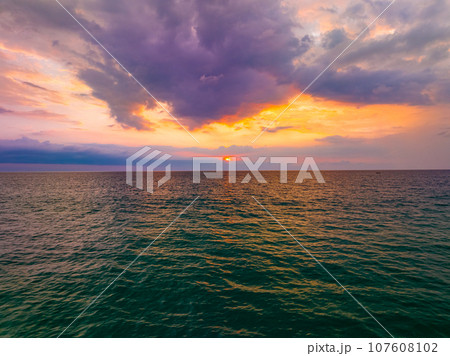 Aerial view sunset sky over sea,Nature Light Sunset or sunrise over ocean,Colorful dramatic scenery sky, Amazing clouds and waves in evening sky, Beautiful light nature background 107608102