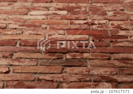 Detail shot of brick wall made from old bricks as a interior design Detail shot of brick wall made from old bricks as a interior design 107617575