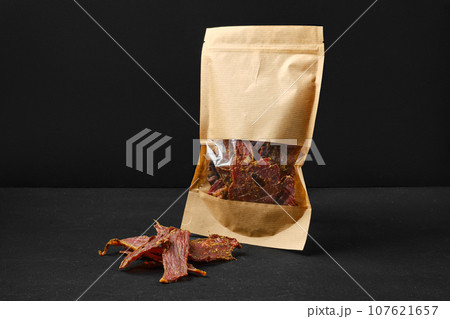 Dehydrated lamb jerky meat in paper pack Dehydrated lamb jerky meat in paper pack 107621657