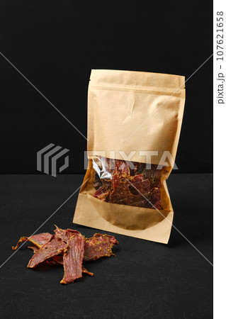 Dehydrated lamb jerky in paper pack Dehydrated lamb jerky in paper pack 107621658